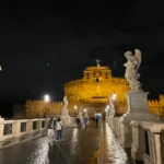Castel Sant Angelo illuminated at night on the banks of the Tiber during a Rome ghost tour